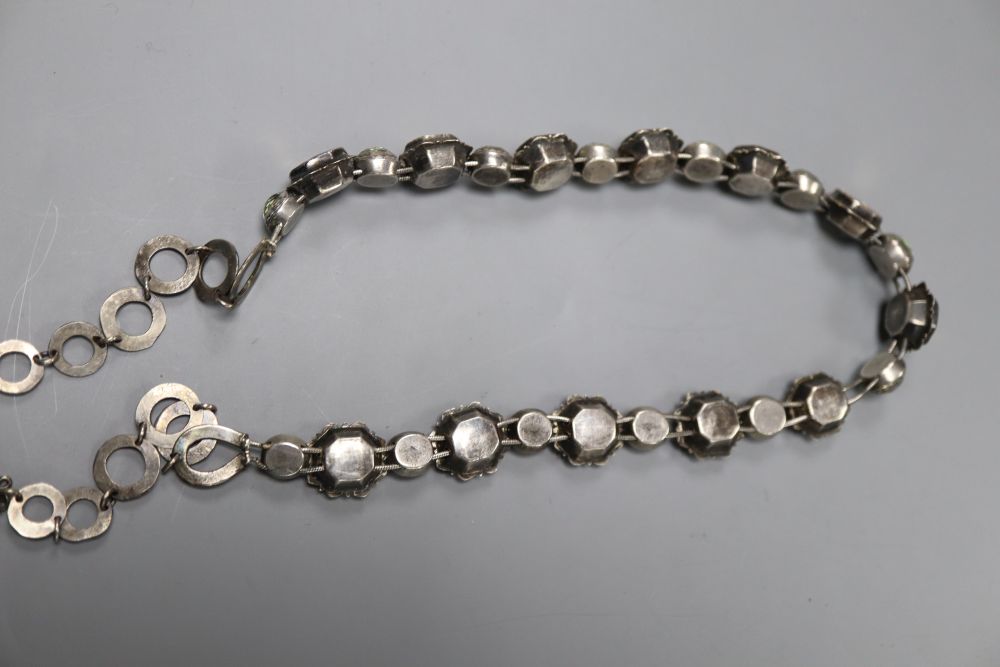 An antique white metal and graduated foil backed paste set necklace, 48cm, gross weight 52.3 grams.